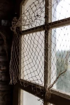 Fishing net on the window Stock Photos