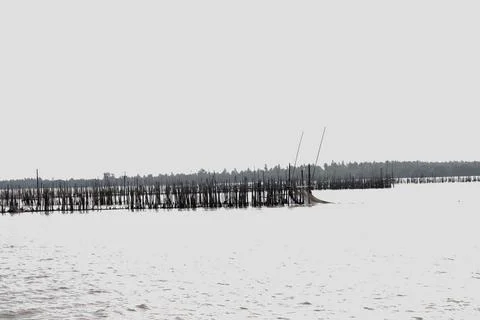 Fishing nets caught on the seashore to catch fish Stock Photos