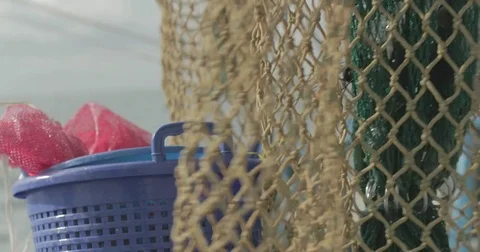Fishing nets hanging on a boat Stock Footage 76679378