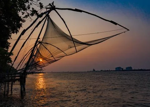 Fishing nets idle at sunset Stock Photos