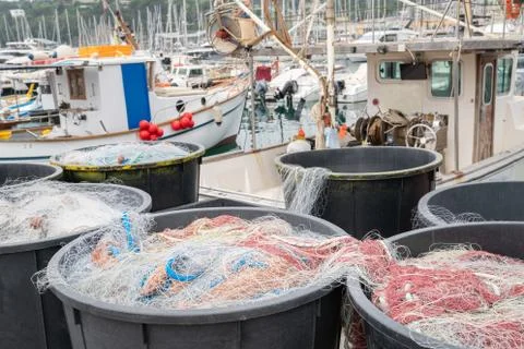 Fishing nets inside plastic bins Stock Photos