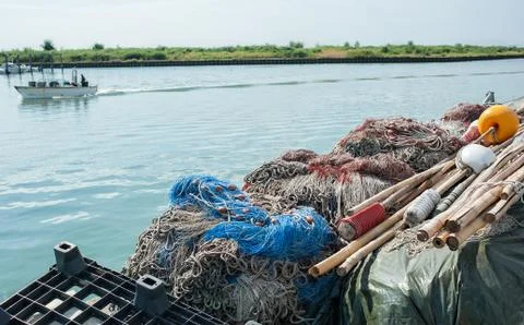 Fishing nets piled in a row Stock Photos