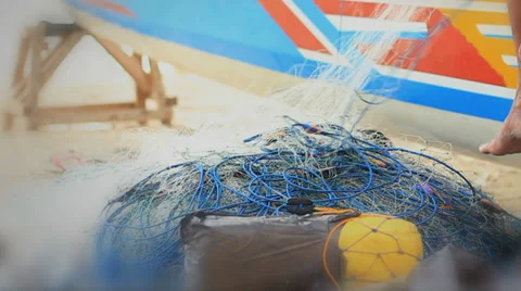 Fishing Nets Pulled onto a Boat on the Beach Stock Footage 35872601