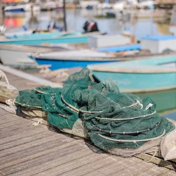 Fishing nets on the quay Stock Photos