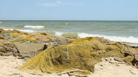 Fishing nets by the sea with waves Stock Footage 111331521