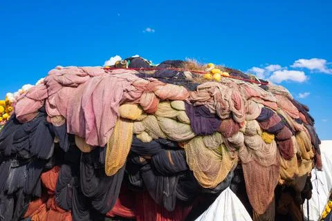 Fishing nets stack or heap in the fishing harbor. Stock Photos