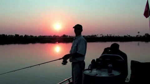 Fishing in the Okavango Delta at sunset Video stock 951190