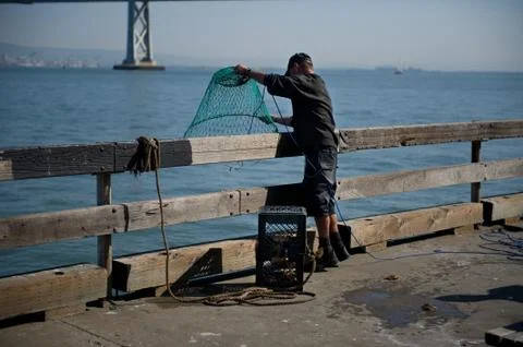 Fishing off the pier Stock-Fotos