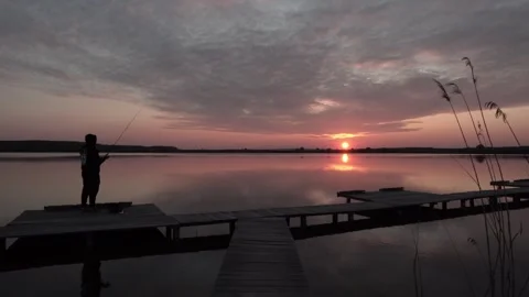 Fishing on the Pier at Sunset Stock Footage 256667417
