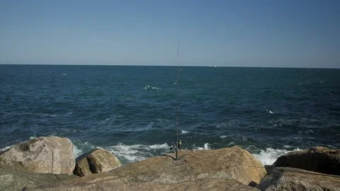 Fishing Pole on the Ocean Rocks Waves Slow Motion 120fps Stock Footage 169061522