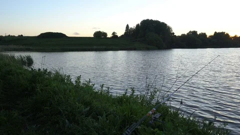 Fishing Pole waiting for fish to bite bait Stock Footage 76140497