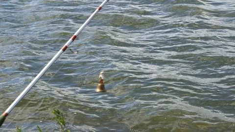 Fishing Pole waiting for fish to bite bait Stock Footage 76169285