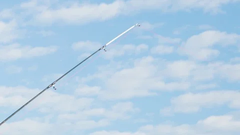 Fishing pole is waiting. Sky background Stock Footage 117409603