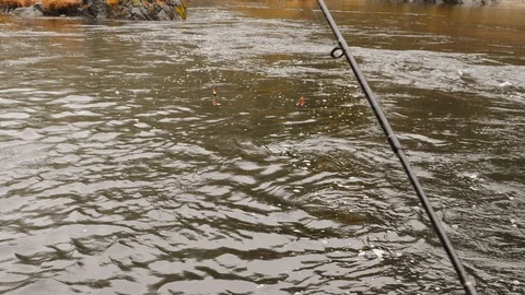 Fishing in the rain with floating bobbers. Stock Footage 99082135