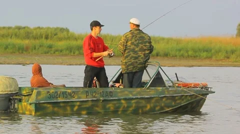 Fishing at the river from the boat Stock Footage 8763376