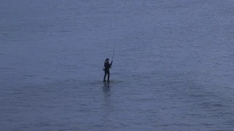 Fishing on rock during high tide 스톡 동영상 67017472