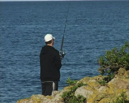 Fishing from rocks Stock Footage 139867