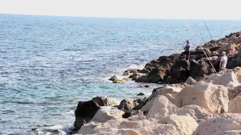 Fishing on the Rocks Stock Footage 135450153