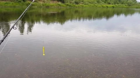 Fishing rod on the background of the river in cloudy weather Stock Footage 255878017