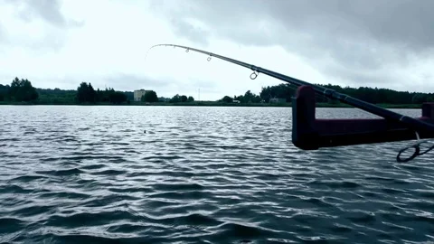 Fishing rod on on background river. Fishpond waiting for fish Stock Footage 77829463