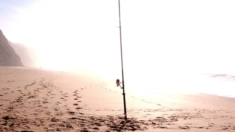 Fishing rod on the beach Stock Footage 143732932