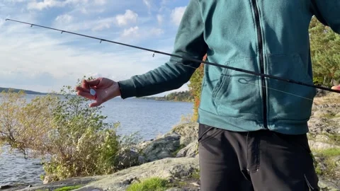 Fishing rod held by a man Video stock 256106141