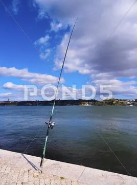 Fishing rod on the riverside Stock Photos