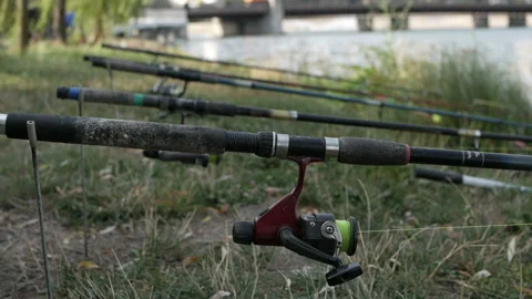The fishing rod is stretched above the surface of the water, fishing gear. Stock-Footage 115491900