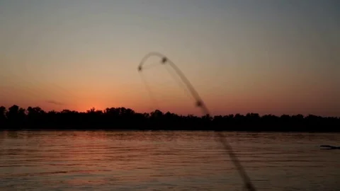 Fishing rod waiting for bite on background evening sunset in river close up Stock Footage 81652398
