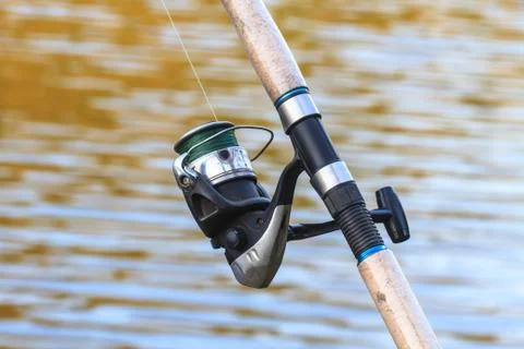 Fishing rods on riverside Stock Photos