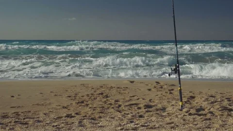 Fishing rods set up on beach shore 스톡 동영상 72655658