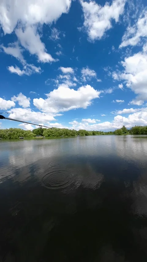 Fishing on a small lake Stockbeeldmateriaal 197829424