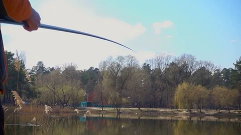Fishing on spring pond. Slow motion 240fps 스톡 동영상 105822813