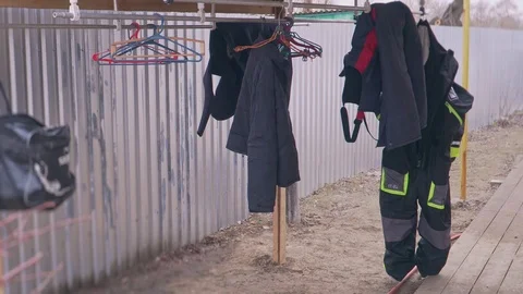 Fishing suits are dried in the yard Stock Footage 102438826