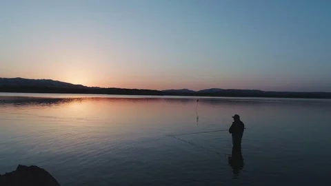 Fishing at sunset Lake Video stock 101410352