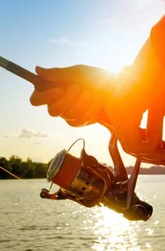 .fishing at sunset Stock Photos