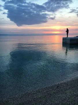 Fishing at sunset Stock Photos