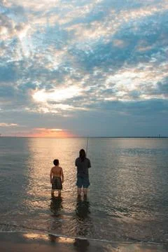 Fishing at the sunset Stock Photos