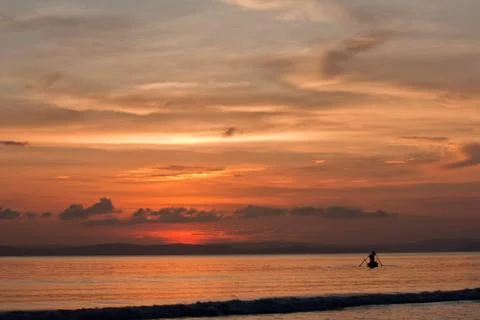 Fishing at sunset Stock Photos