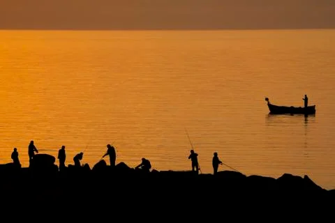 Fishing at sunset Stock-Fotos