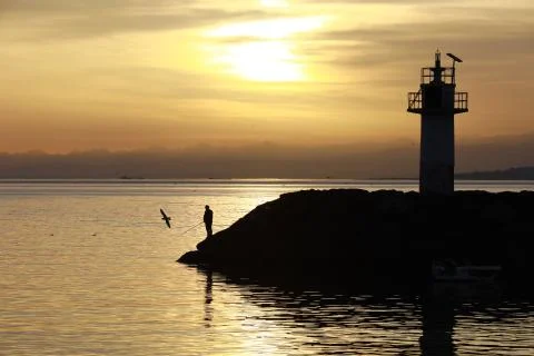 Fishing at sunset Foto stock