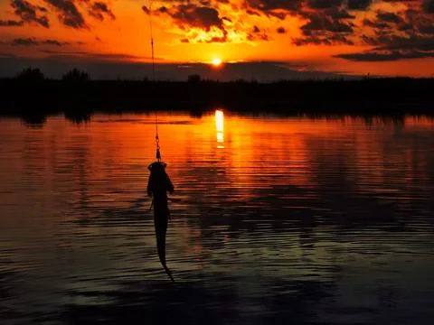 Fishing at sunset Stock-Fotos
