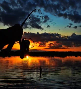 Fishing at sunset Stock-Fotos