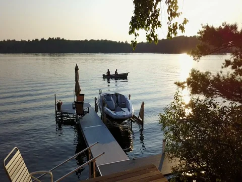 Fishing at Sunset: Right/Backward Track Stock Footage 80933645