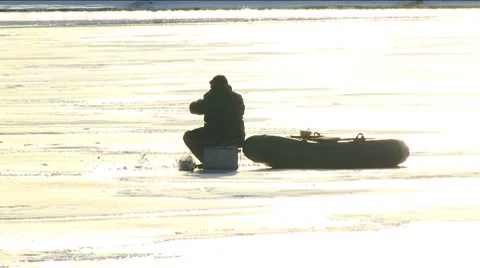 Fishing Through the Ice Stockbeeldmateriaal 7737740