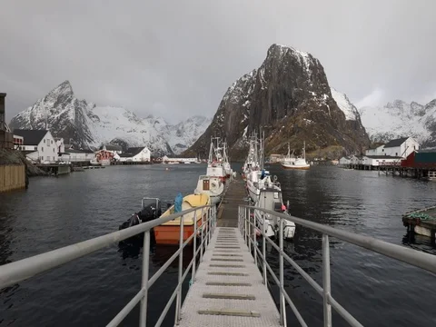 Fishing vessel at the settlements pier of Lofoten islands. Stock Footage