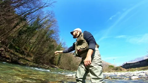 Fishing in a water stream river Stock Footage 107101841