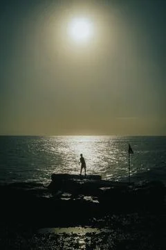 Fishing with the waves Stock Photos