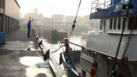 Fishingboat stops in harbor Stock Footage 39832833