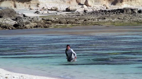 Fishman at the ocean Stock Footage 27446780